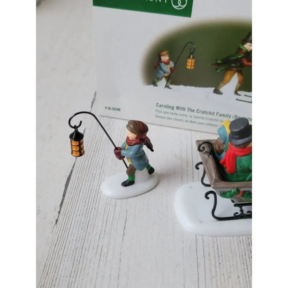 Dept 56 58396 Caroling With The Cratchit Family (Revisited) village accessory xm